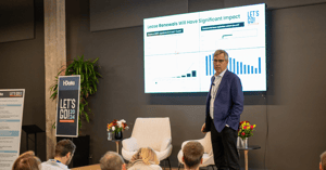 Greg Bolino presenting on stage at LET'S GO! 2024